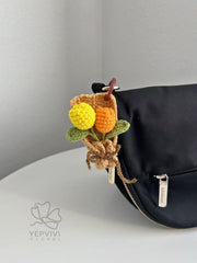Crochet Tulip Bouquet Bag Charm: Handmade yarn Flower Keychain. Pink, purple, blue, orange.