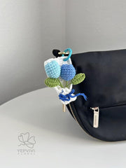 Crochet Tulip Bouquet Bag Charm: Handmade yarn Flower Keychain. Pink, purple, blue, orange.