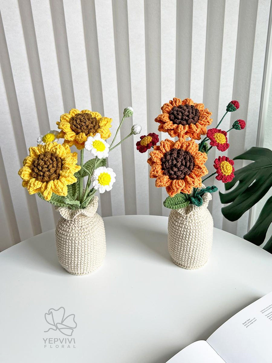 Sonnenblumen und Gänseblümchen im Topf